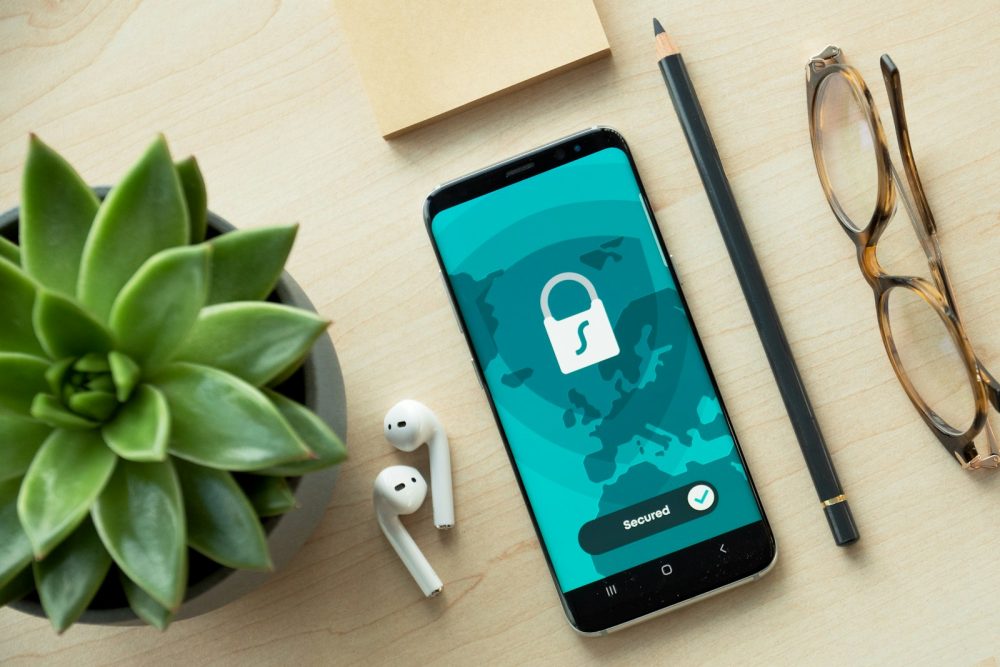 A smartphone showing a lock icon on a desk
